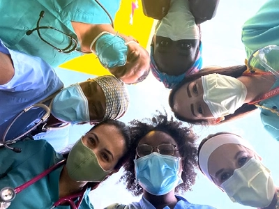 selfie of doctors posing and smiling at the camera