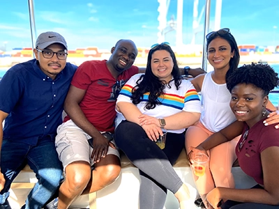 group of people posing and smiling at the camera