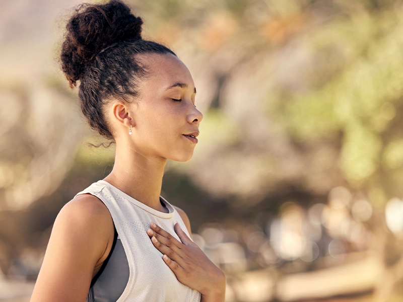 closeup of woman breathing deep