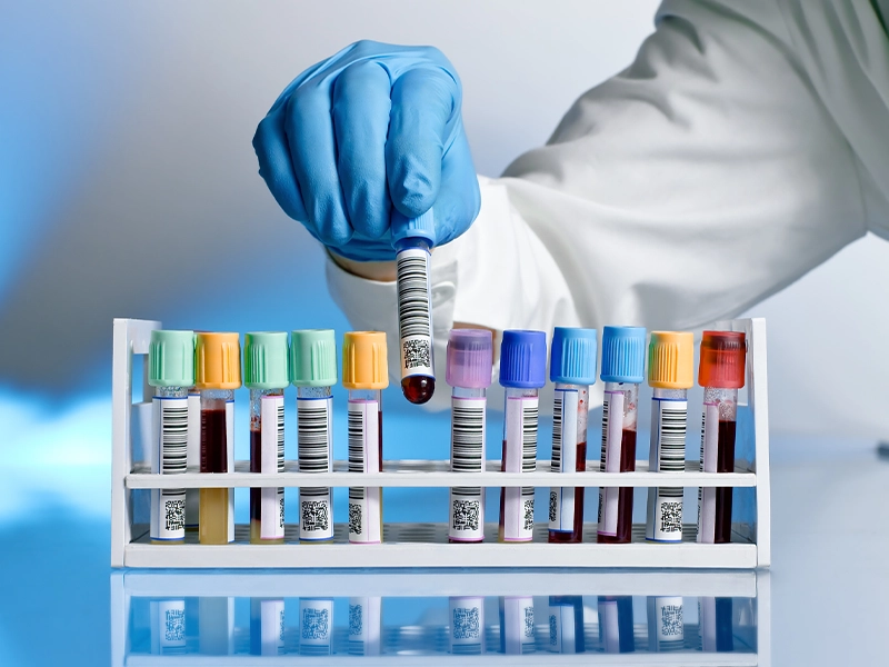 closeup of hand manipulating medicines in bottles