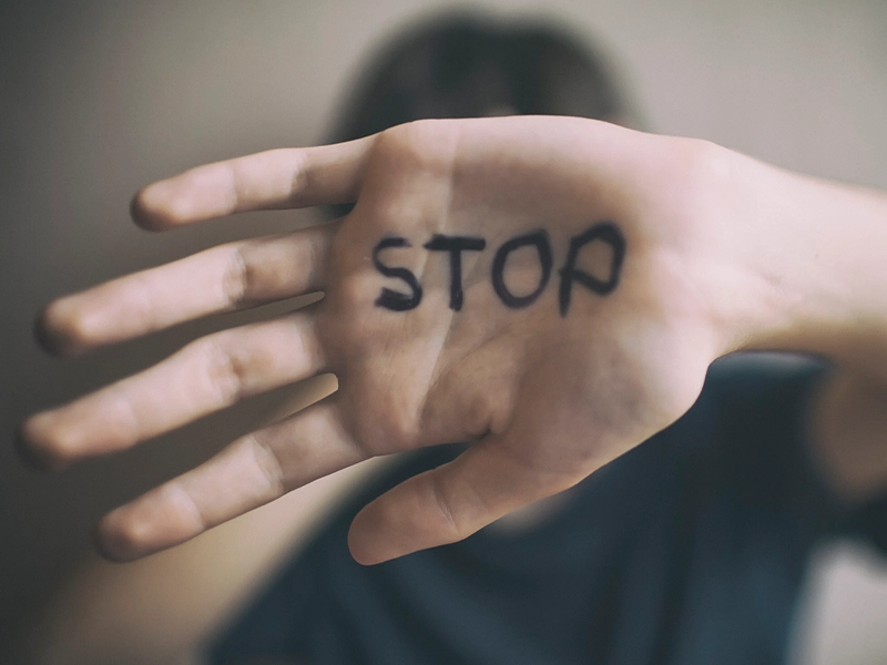 closeup of hand with text that reads stop