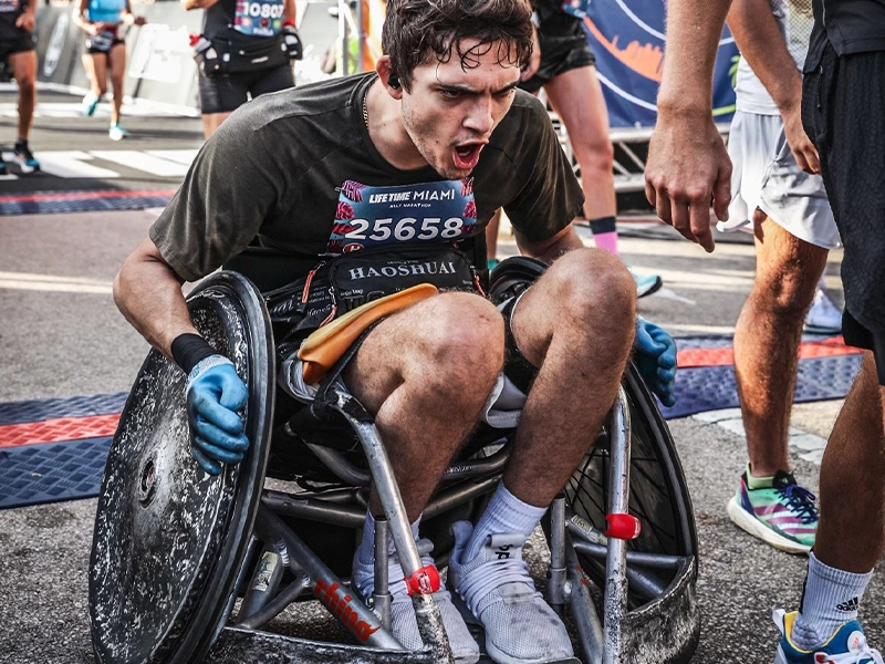man in wheelchair competing in race