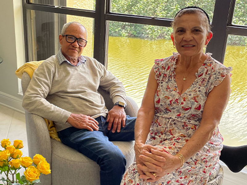 couple sitting smiling at camera