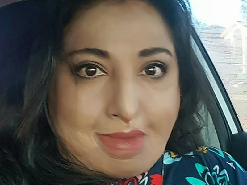 Feride Buch sitting in a car and looking at the camera