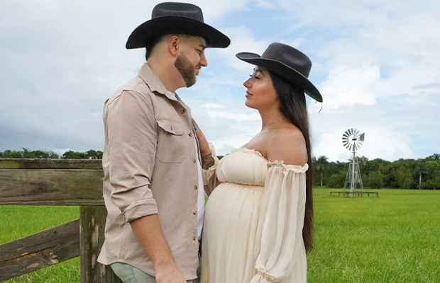 Pregnant woman staring intently at her partner.