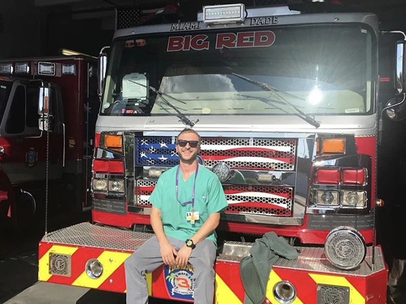 man sitting in fire truck