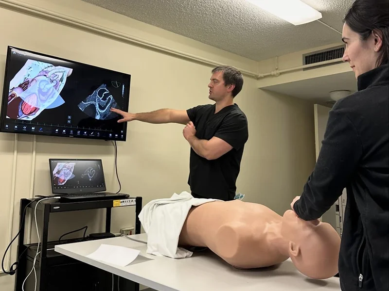 doctors doing practices with a prototype of a human body
