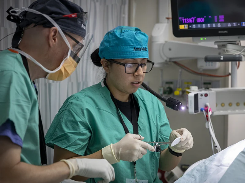 two doctors doing a surgery