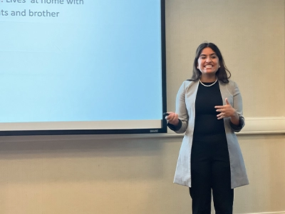 woman giving a talk in auditorium