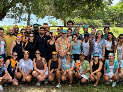 Large group of people smiling and posing for the camera