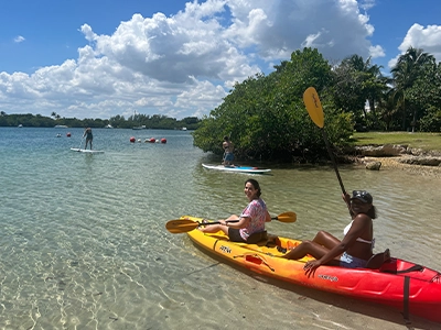 two women kayaking