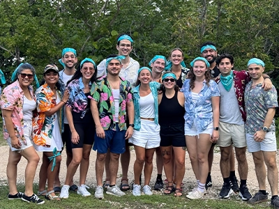 group of people smiling and posing for the camera