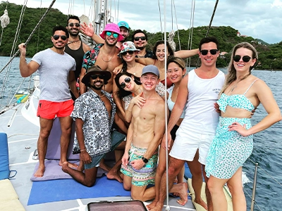 group of people posing from a yacht