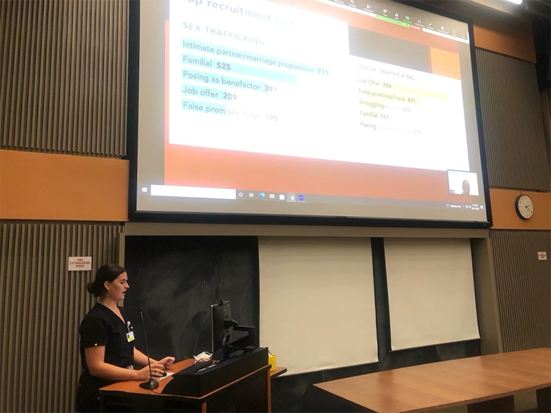 woman making presentation in auditorium