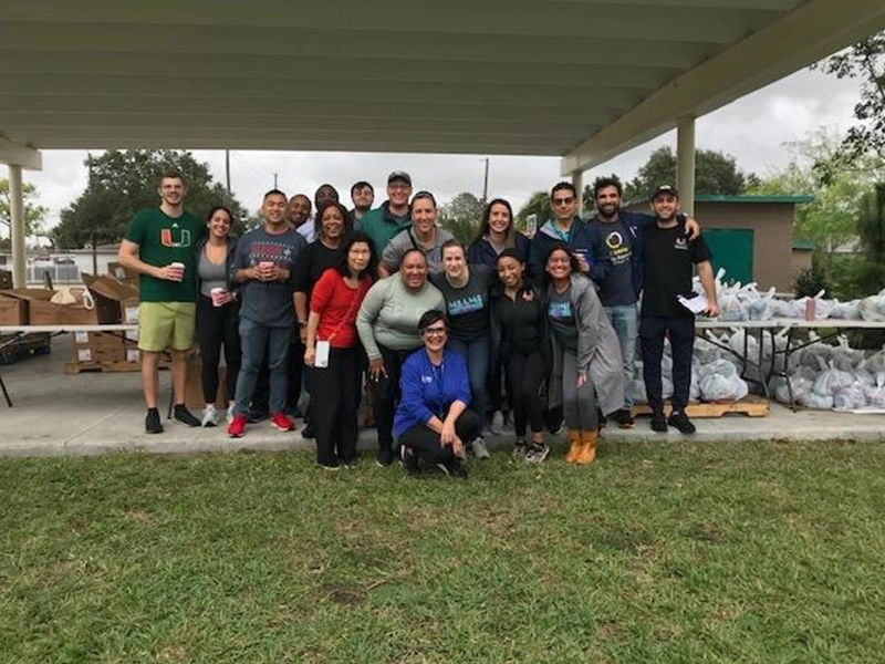 group of people posing and smiling at the camera