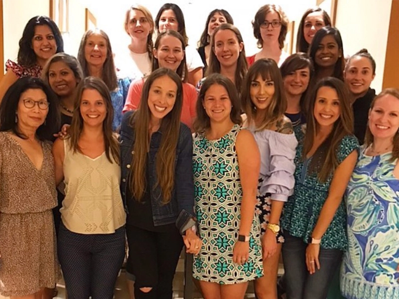 Group of women posing and smiling at the camera