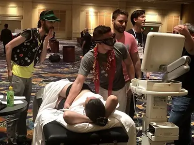 doctors examining patient from stretcher