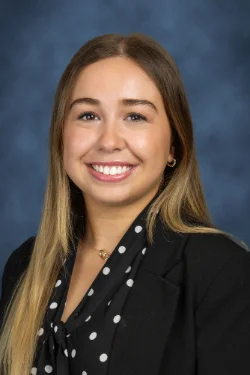 A headshot of a woman smiling