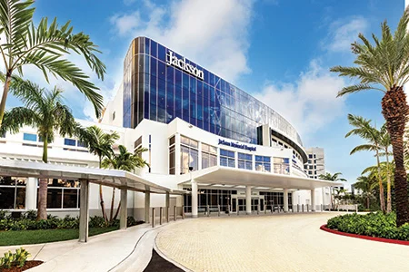 An external image of a building that reads Jackson Memorial Hospital