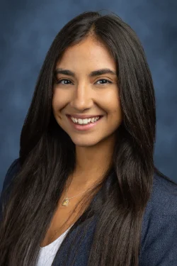 A headshot of a woman smiling