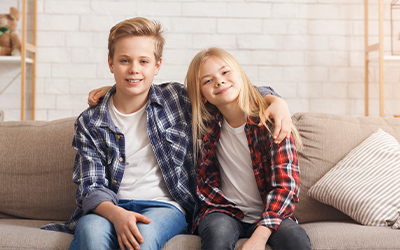 children sitting and hugging