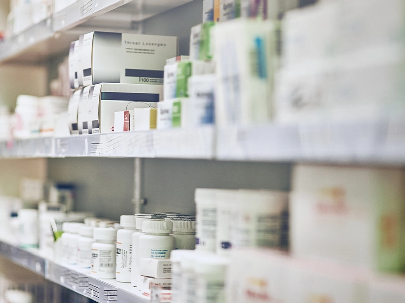 pharmacy shelf full of medicines