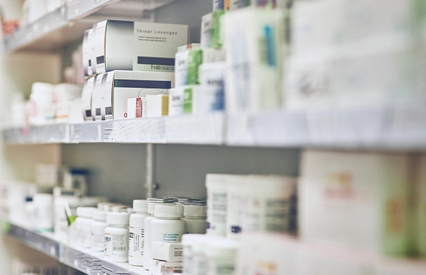 pharmacy shelf full of medicines