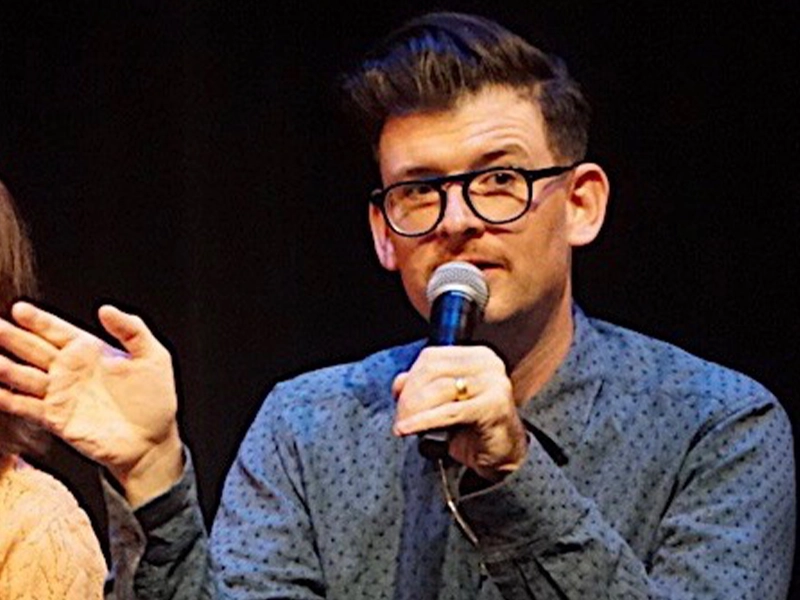picture of Moshe Kasher on a conference