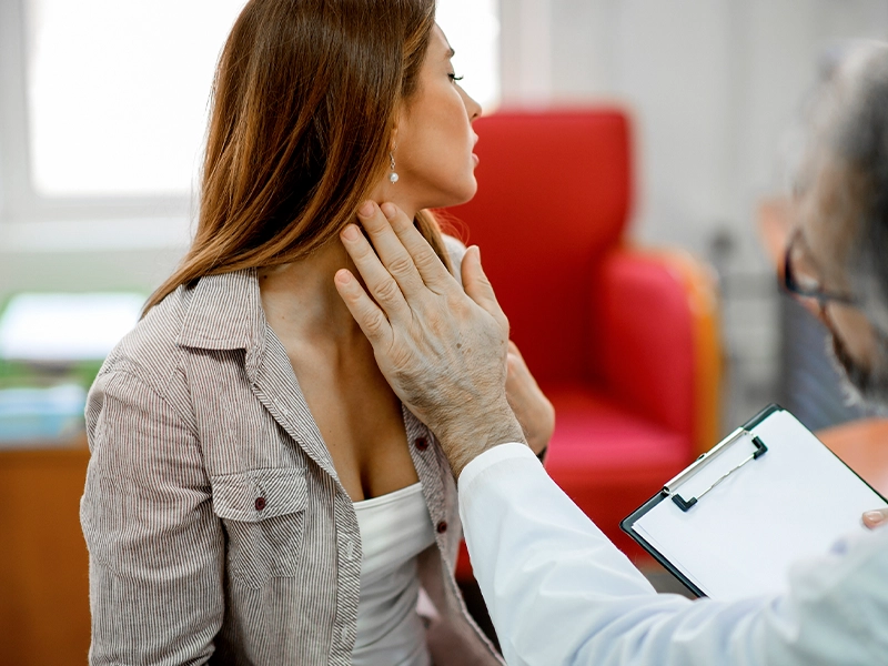 A woman being examined by her doctor.
