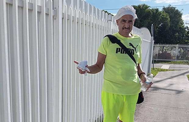 man with bandage on his head posing for the camera