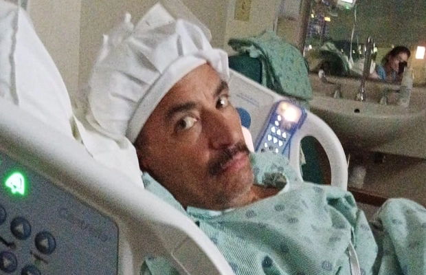 man lying on hospital stretcher