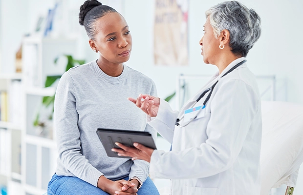 a woman talking to her doctor