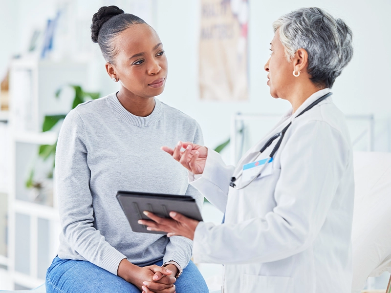 a woman talking to her doctor