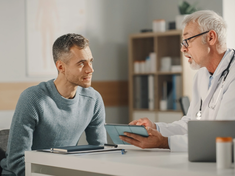 man talking to his doctor