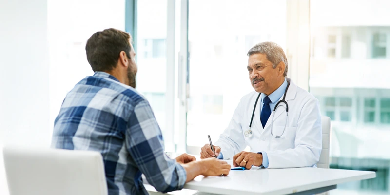 A medical professional speaking to a patient