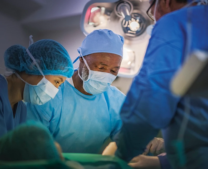 A group of medical professionals performing surgery