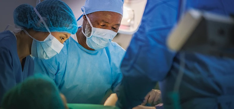 A group of medical professionals performing surgery