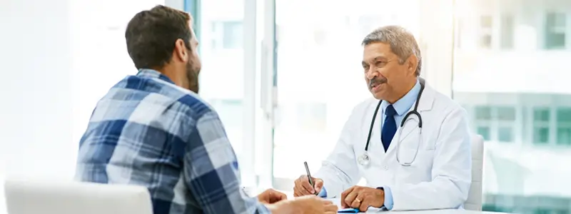 A medical professional speaking to a patient