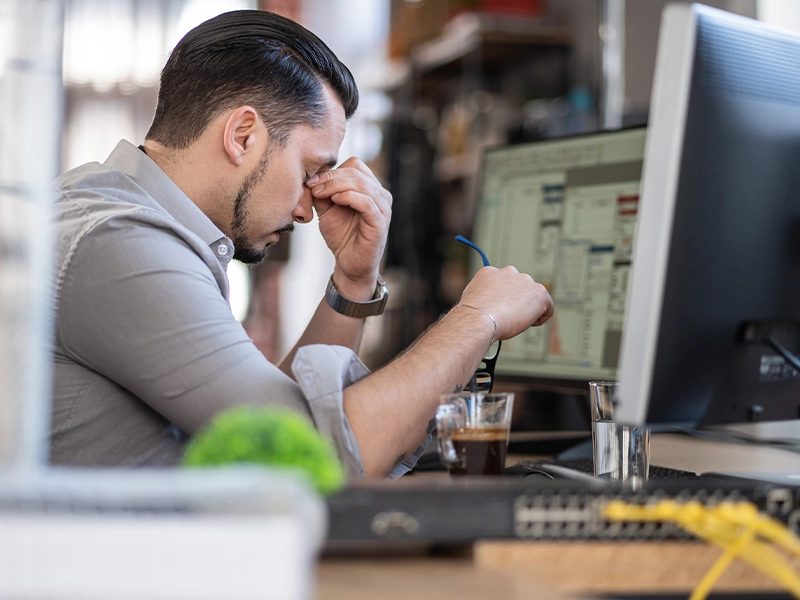 stressed man in front of the computer