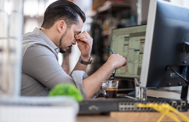 stressed man in front of the computer