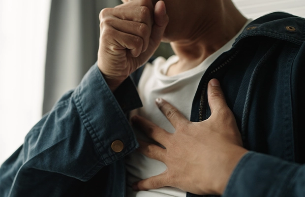 close-up of a person coughing