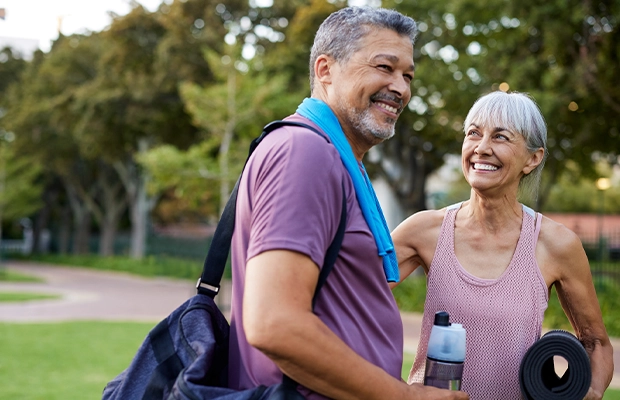 elderly couple walking in the park