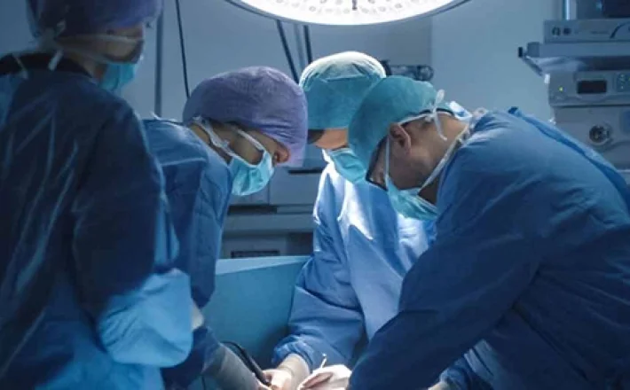 Surgeons performing surgery