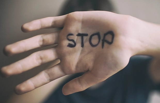 closeup of hand with text that reads stop