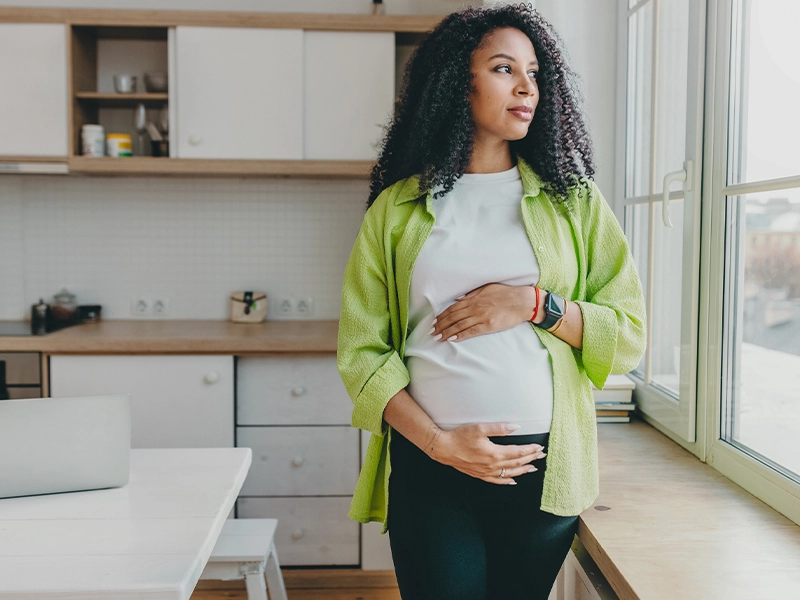 pregnant woman caressing her belly