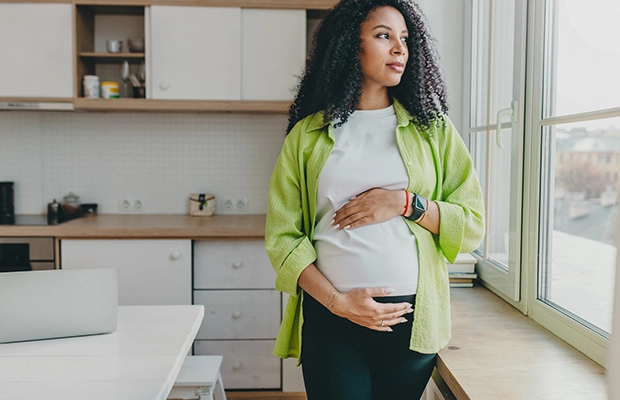 pregnant woman caressing her belly