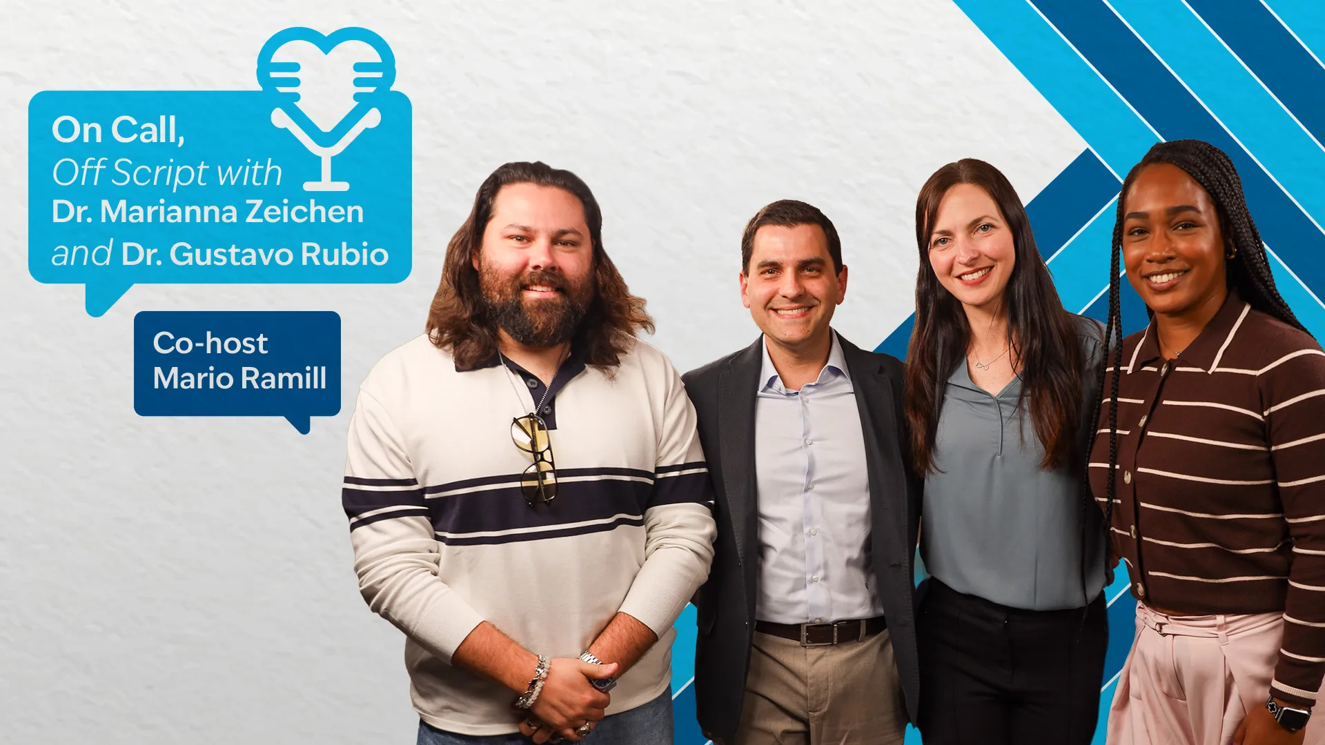 Two men and two women posing with a background of blue lies behind them.
