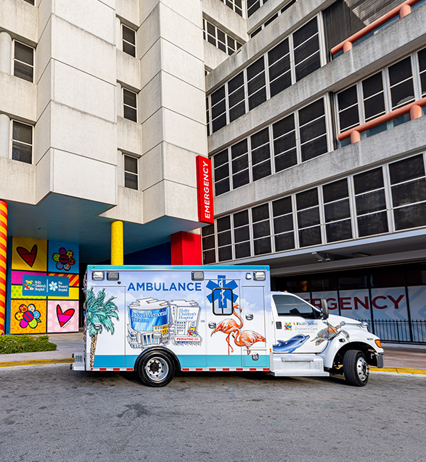 An ambulance for Holtz Children's Hospital outside of a Pediatric Emergency Room