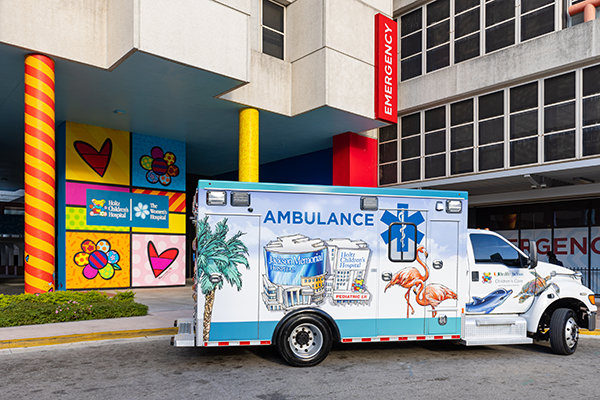An ambulance for Holtz Children's Hospital outside of a Pediatric Emergency Room
