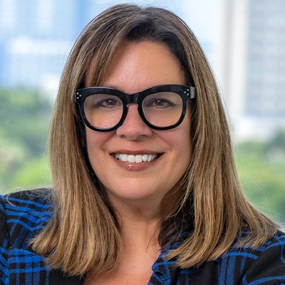 Close up of a blonde women with glasses